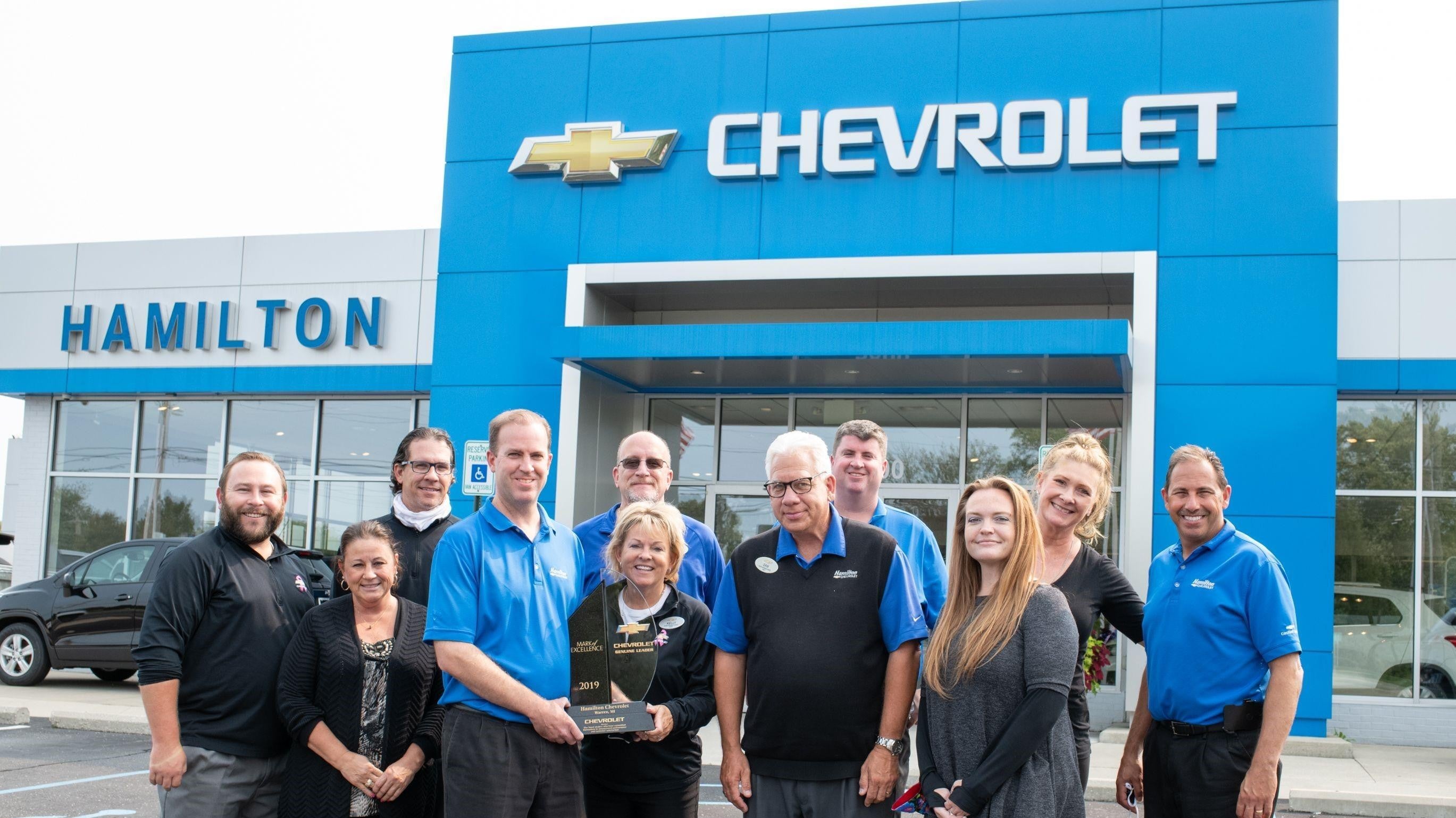 Hamilton Chevrolet team holding the 2019 Mark of Excellence award